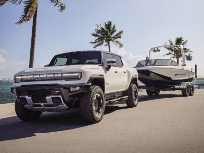 2024 GMC Hummer EV demonstrating its towing capabilities