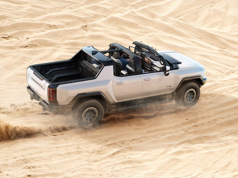 2024 GMC Hummer EV side profile highlighting its rugged exterior design