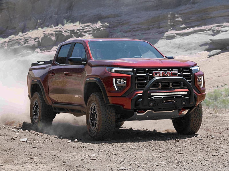 2024 GMC Canyon Photograph in front of a vast canyon